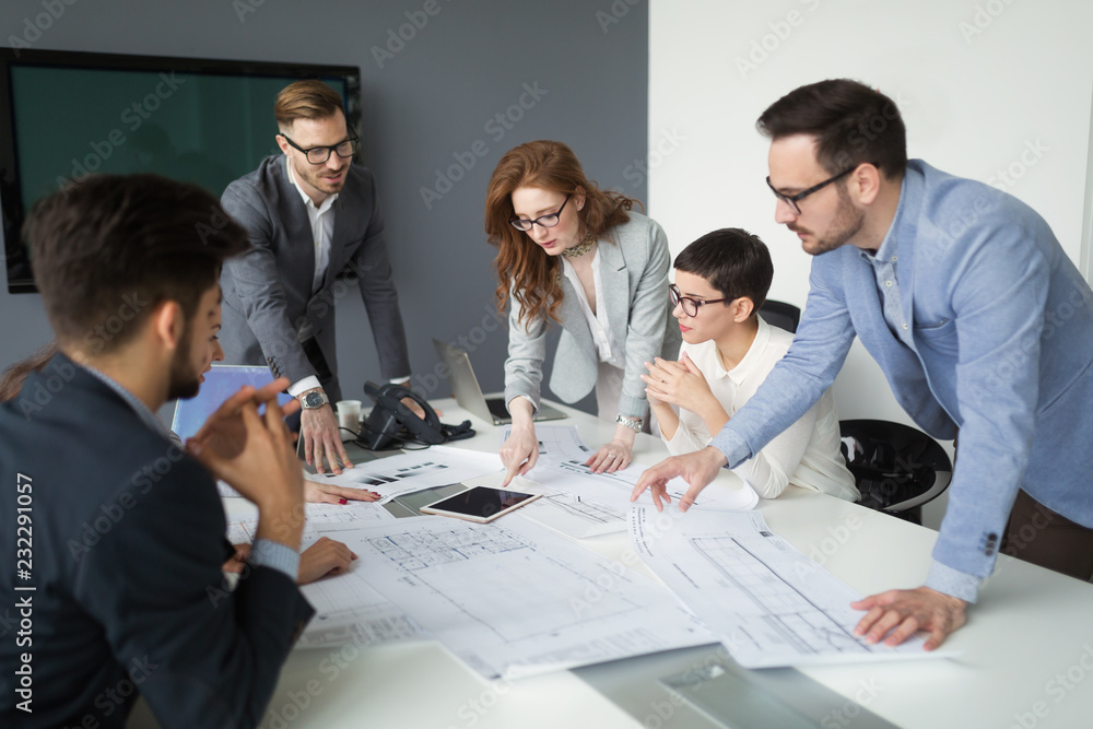 Group of architects working on project in office - obrazy, fototapety, plakaty 