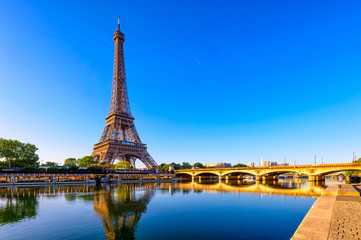 Fototapete - View of Eiffel Tower and river Seine at sunrise in Paris, France. Eiffel Tower is one of the most iconic landmarks of Paris