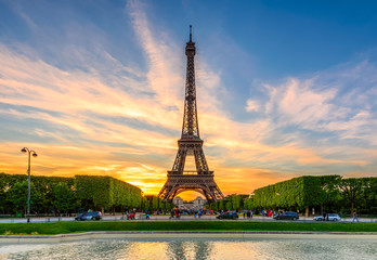 Fototapete - Paris Eiffel Tower and Champ de Mars in Paris, France. Eiffel Tower is one of the most iconic landmarks in Paris. The Champ de Mars is a large public park in Paris.