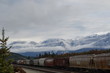 Canadian freight train,   railway, train, rail, railroad,  clouds, mountains with snow