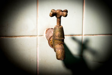 Old Rusty Tap On Concrete Wall