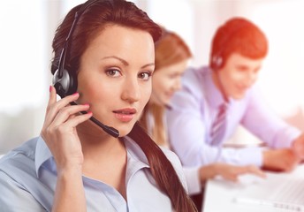 Close-up view of young woman face with headphones, call center