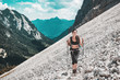 © XtravaganT - Young woman hiking on steep mountain slope