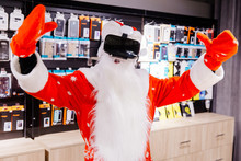 Santa Claus In Appliance Store In Red