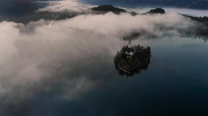 Sticker - Romantic church on island at lake Bled in Slovenia at foggy morning,aerial drone footage