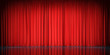 Theater stage with red velvet curtains. 