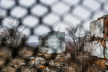 Old destroyed an abandoned multi-storey building in a military t