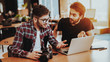 © VadimGuzhva - Photographers With Camera Works on Laptop Indoors