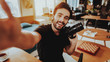 © VadimGuzhva - Smiling Guy Make Selfie when Working at Workplace