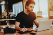 © VadimGuzhva - Graphic Designer Works on Digital Tablet Indoors