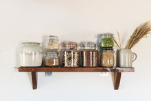 Ingredients In Jars On A Wooden Shelf