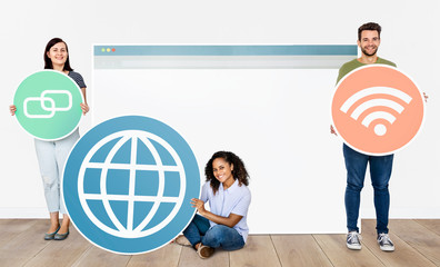 Wall Mural - People holding icons related to the theme of internet and connection