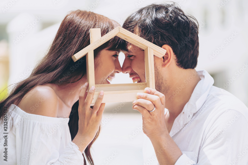 Young couple planning to buy a house and have happy living. - obrazy, fototapety, plakaty 