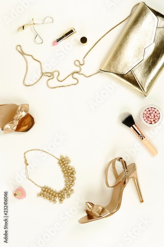 gold heels and clutch bag