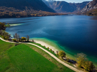 Wall Mural - Beautiful blue water and green pasture,Bohijn lake , aerial view,Slovenia