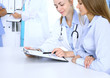 © rogerphoto - Doctor and patient are discussing something, just hands at the table. Medicine concept