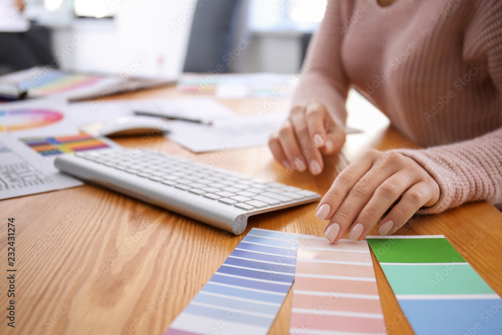 Beautiful young designer working in office, closeup
