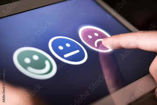 Fotografía Unhappy and disappointed customer giving low rating and negative feedback in survey, poll or questionnaire