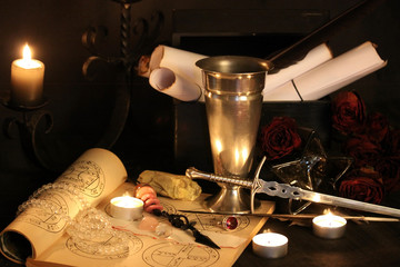 Wall Mural - Antique Magic Book. Witchcraft Peacock feathers and candle background. Black candle Magic Ritual.