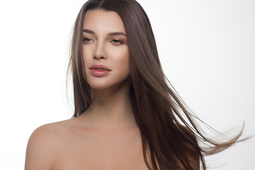 Closeup portrait of a woman with developing straight hair. Sweet tender young girl, brunette. Natural lip makeup, transparent transparent skin. Beauty, spa, injections, cosmetology, beautiful