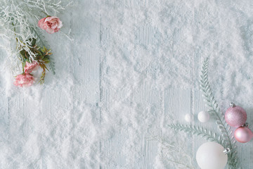 Wall Mural - white wooden table background with snow and christmas decoration. creative winter top view. minimal 