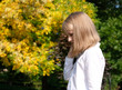 © smallblackcat - Portrait of a smiling little girl on an autumn  background