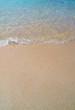 waves against the beach a beautiful summer day