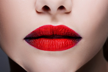 Beautiful women's lips with bright red lipstick, bright stylish makeup,