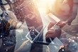 © alphaspirit - Business people work together with laptop and tablet. Concept of teamwork and startup. Double exposure