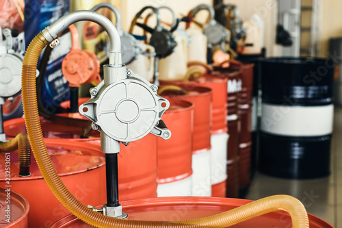 Cuadros en Lienzo Motor oil in barrels with pump indoors with copy space