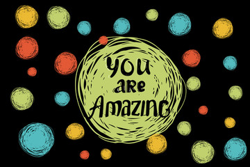 You are amazing. Hand drawing ink lettering vector art, modern brush calligraphy motivational poster on a creative vector background. Hand lettering quote.black background with yellow red green doodle
