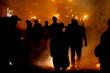 Fire, smoke and silhouetted people at Lewes Bonfire Celebrations
