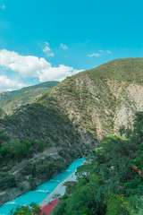 Wall Mural - Panoramic view of mountains on blue sky