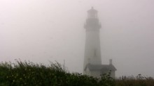 Lighthouse In A Gray Windy Fog