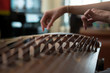 © Stocksy - Young Singaporean woman playing the Guzheng