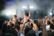 © Stocksy - Taking photo, video, life streaming at concert