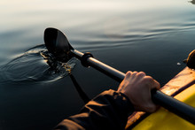 Kayak Paddle Reflection On A Lake At Sunrise