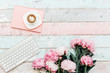 Flat lay home office desk.Pink peony bouquet, coffee and keyboard on wooden background.Top view feminine. Flat lay home office desk. Woman workspace