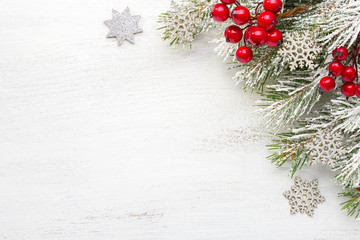 Wall Mural - Fir branch with Christmas decorations on old wooden shabby background with empty space for text. Top view.