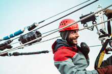 A Young Man Smiles During An Outdoor Zip Line Course