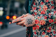© Stocksy - Tattooed handsome man with colourful flower jacket around the city.