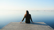 © Stocksy - Dreaming person relaxing on pier alone