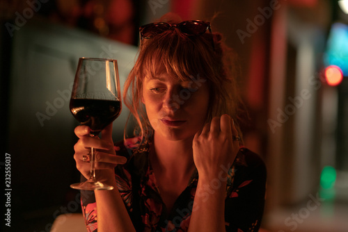 Beautiful Ginger Girl Drinking A Glass Of Red Wine Near A Fire Pit