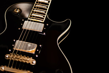 Isolated electric guitar on black background