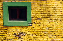 Window In Yellow Brick Wall