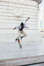 Young Men Skating At Square, Lisbon, Portugal