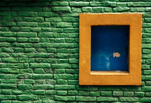 Window In Green Brick Wall
