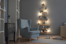 Minimal Handmade Christmas Tree Illuminated By Warm Light Bulbs