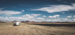 © Stocksy - panorama shot of a camping truck in mongolian desert