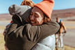 © Stocksy - Friends hugging on an airfield after flying glider planes